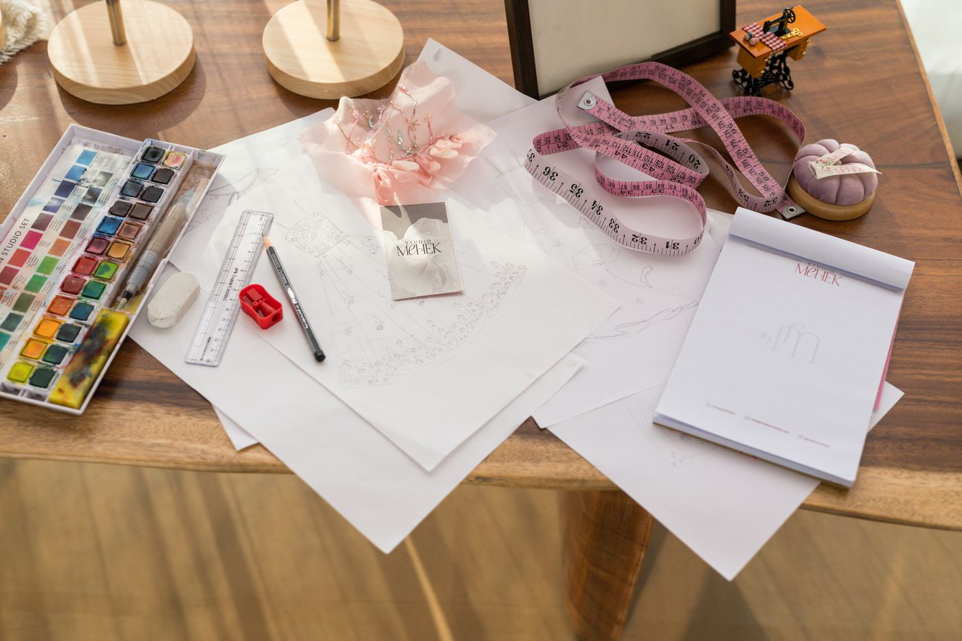 Studio Mehek design sketches laid out with watercolours